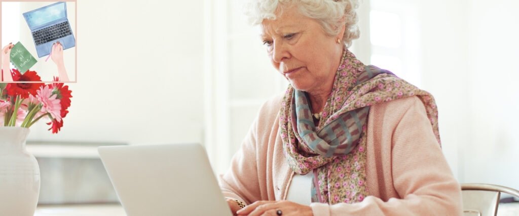 Older woman using a laptop at a bright table, illustrating learning self-publishing tasks one step at a time.