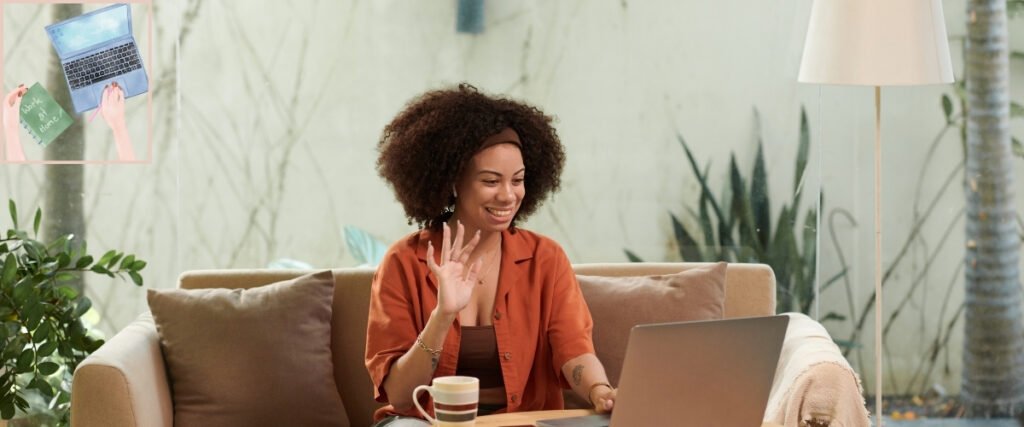 Woman waving during a laptop video call from her sofa, illustrating online communication as part of working from home.