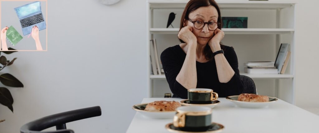 Woman resting her chin in her hands at a table, illustrating the uncertainty of finding a first virtual-assistant client.